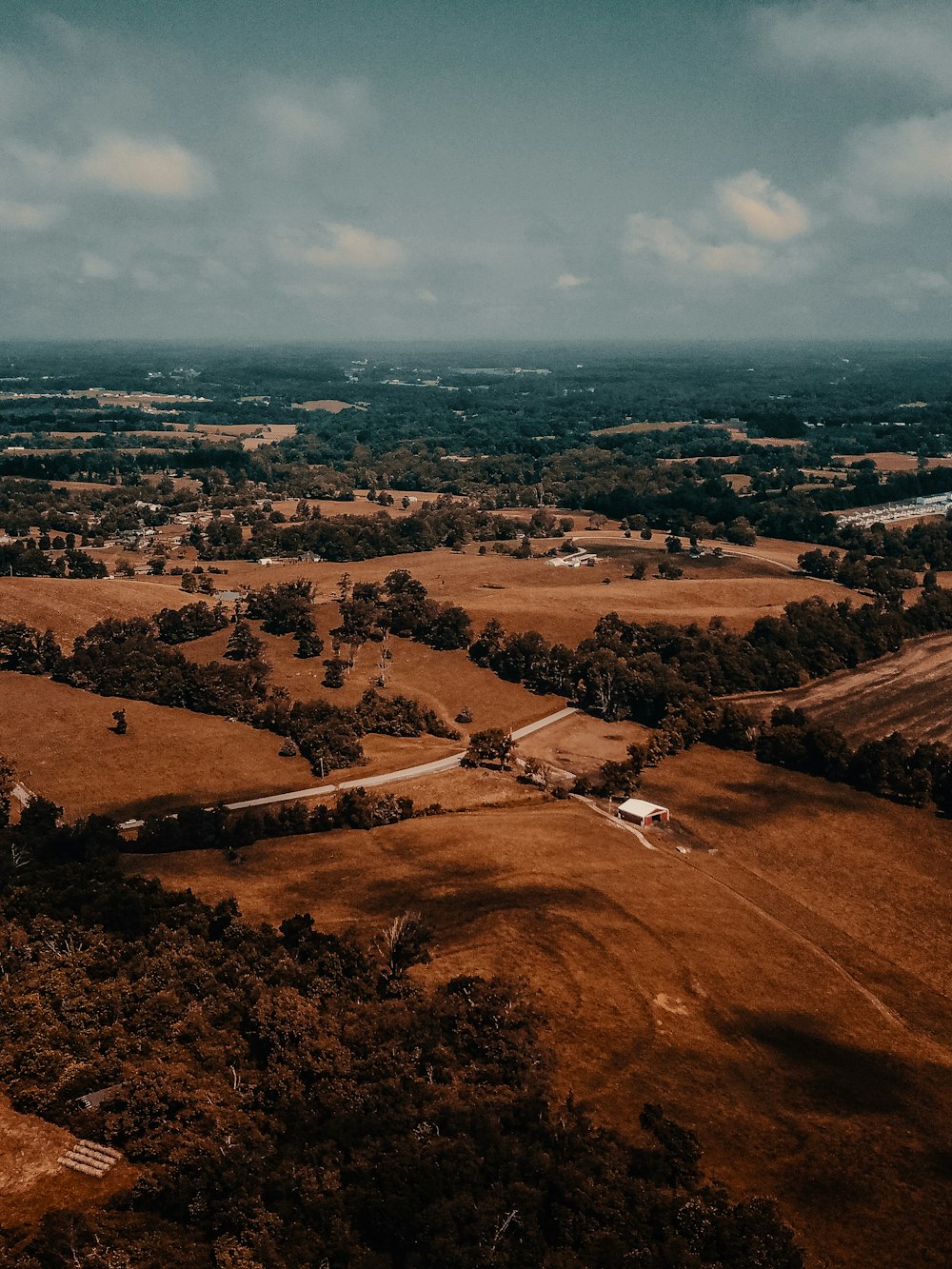 aerial view of brown field during daytime