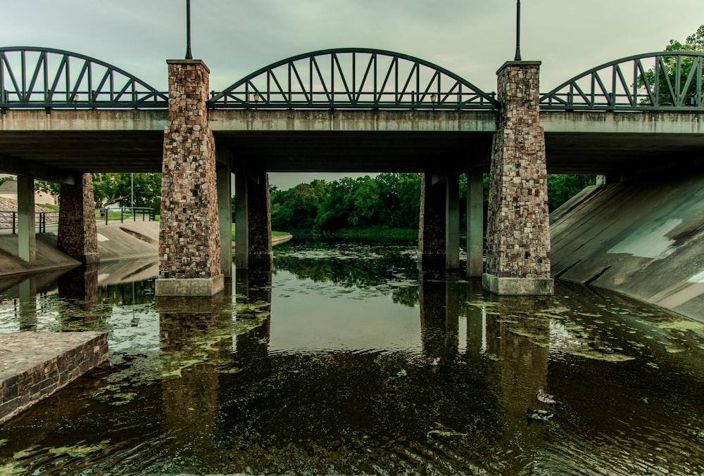 brown concrete bridge over river