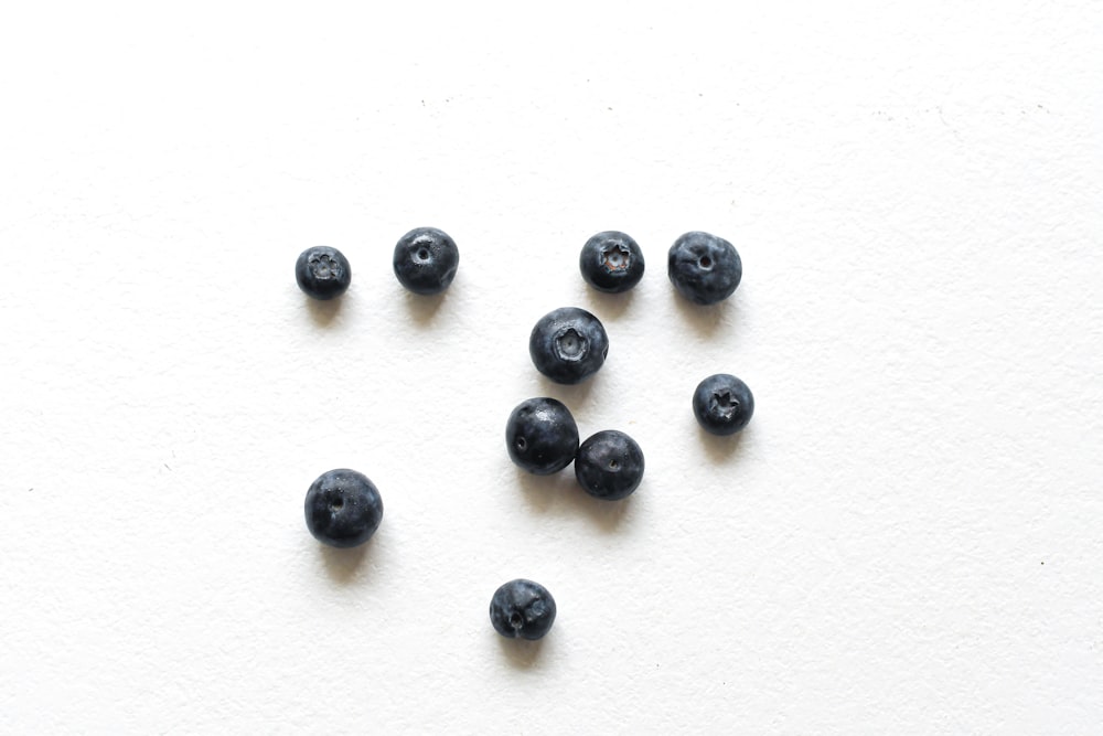 black beads on white surface