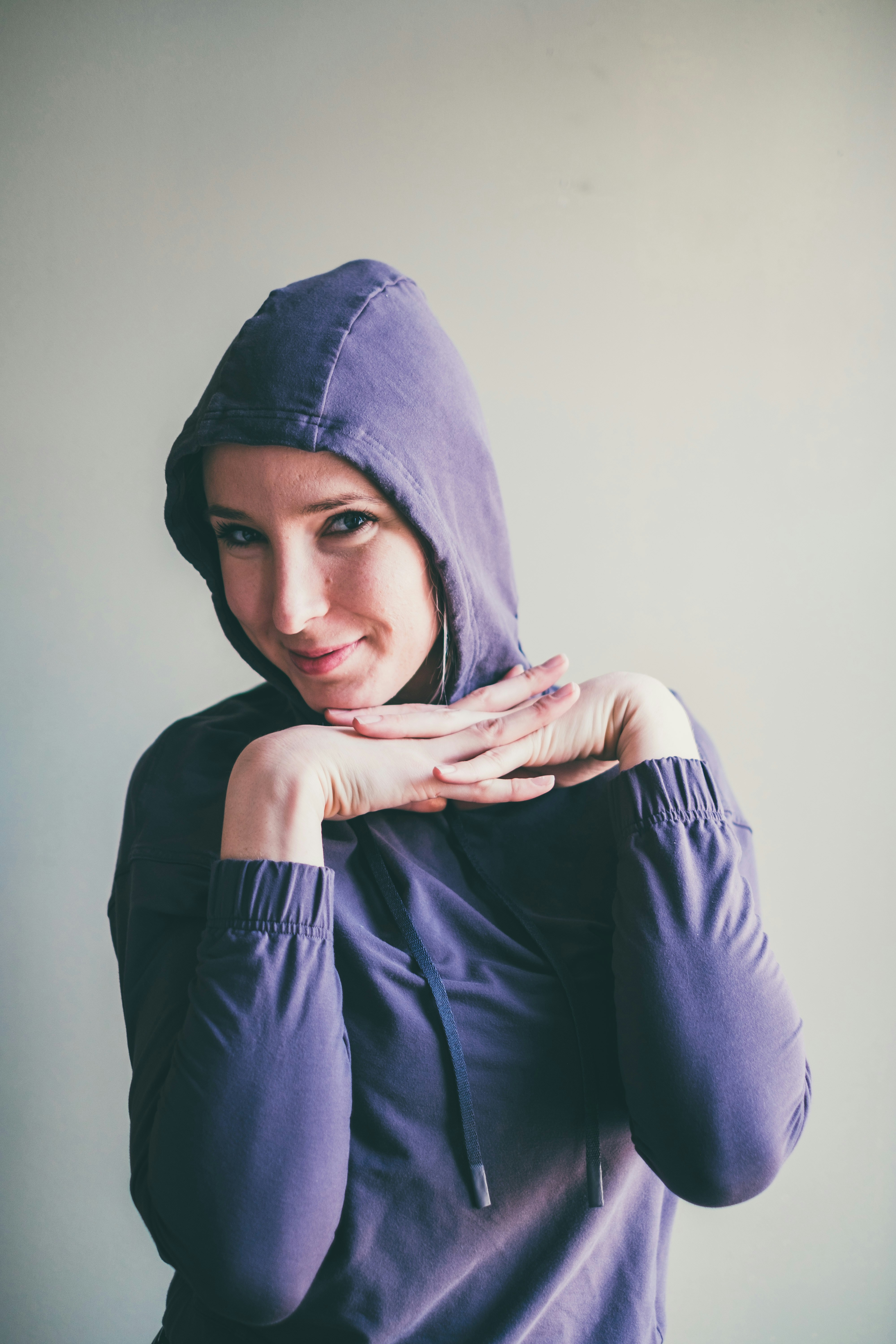 woman in blue hijab covering her face with blue hijab