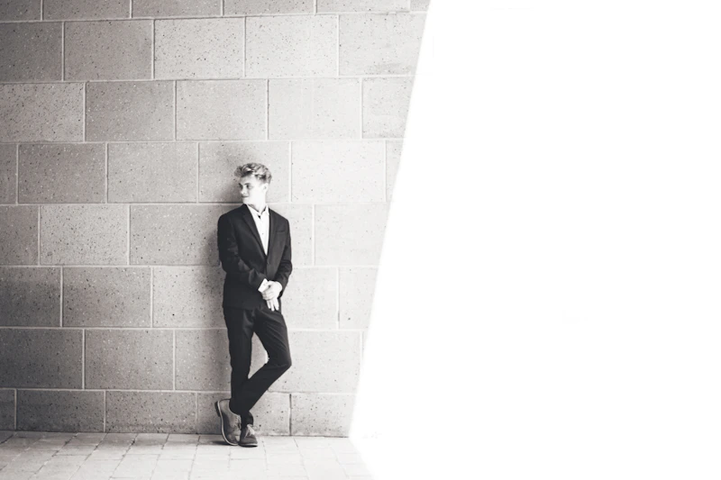 elegant gay sugar daddy in a black suit