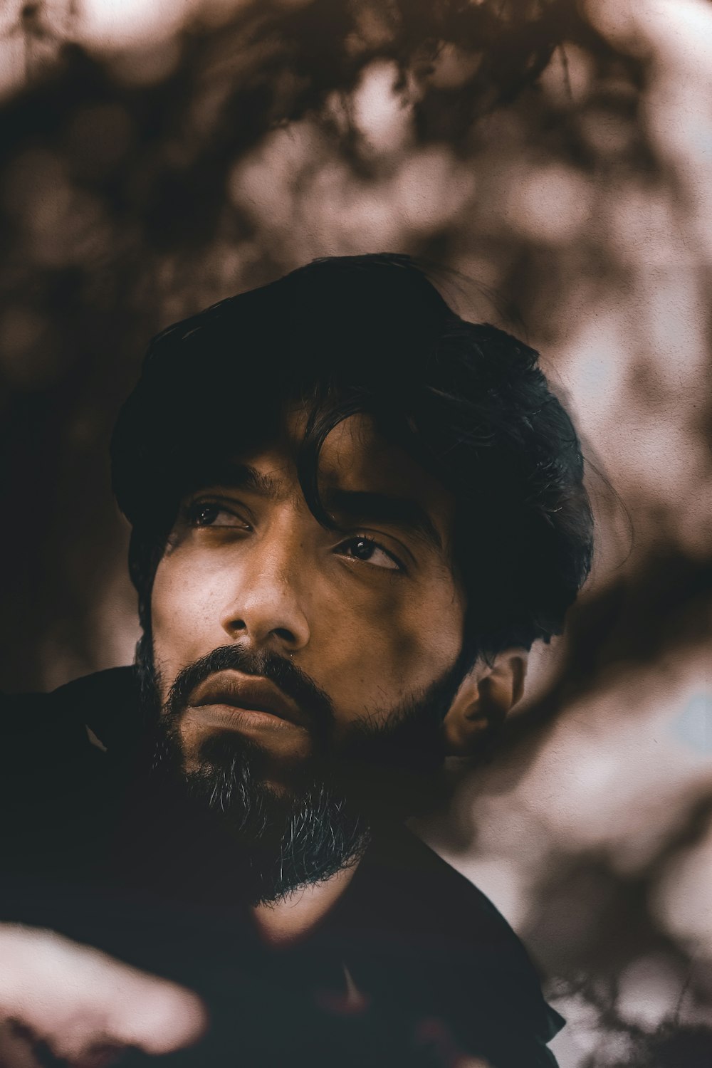 man in black shirt in grayscale photography