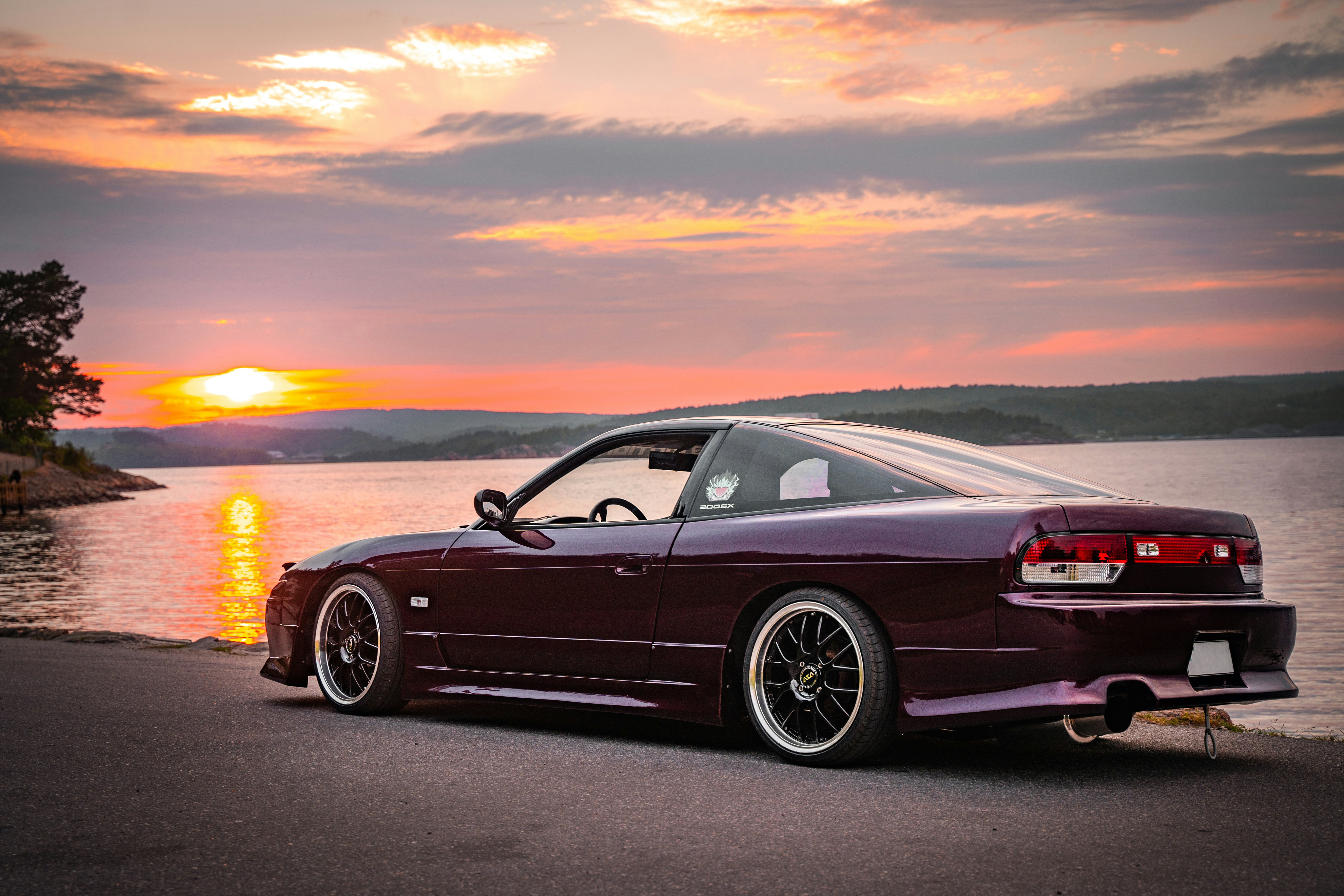 black bmw coupe on road during sunset