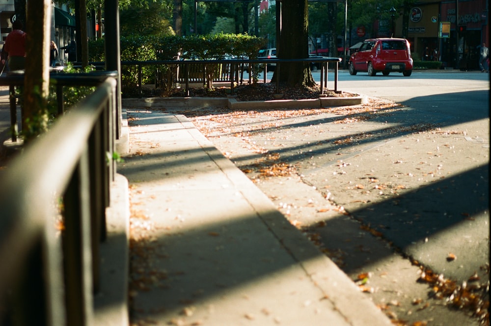 red car on road during daytime