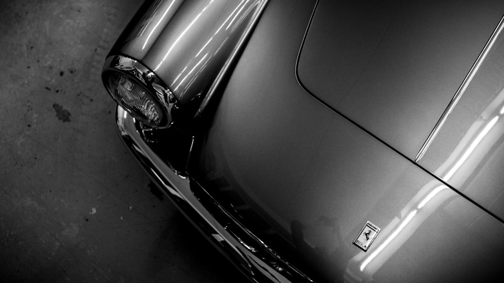 grayscale photo of car headlight