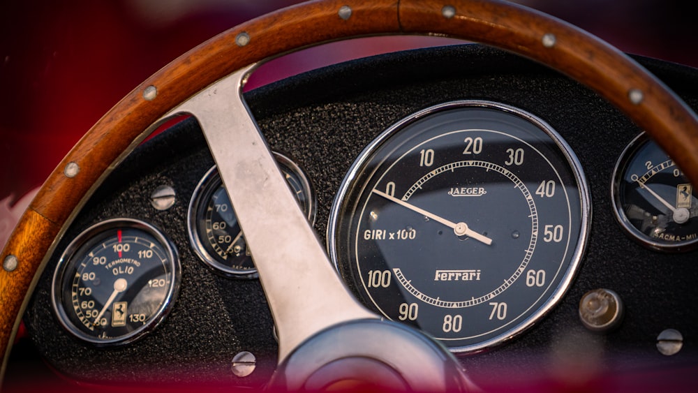 black and brown analog speedometer