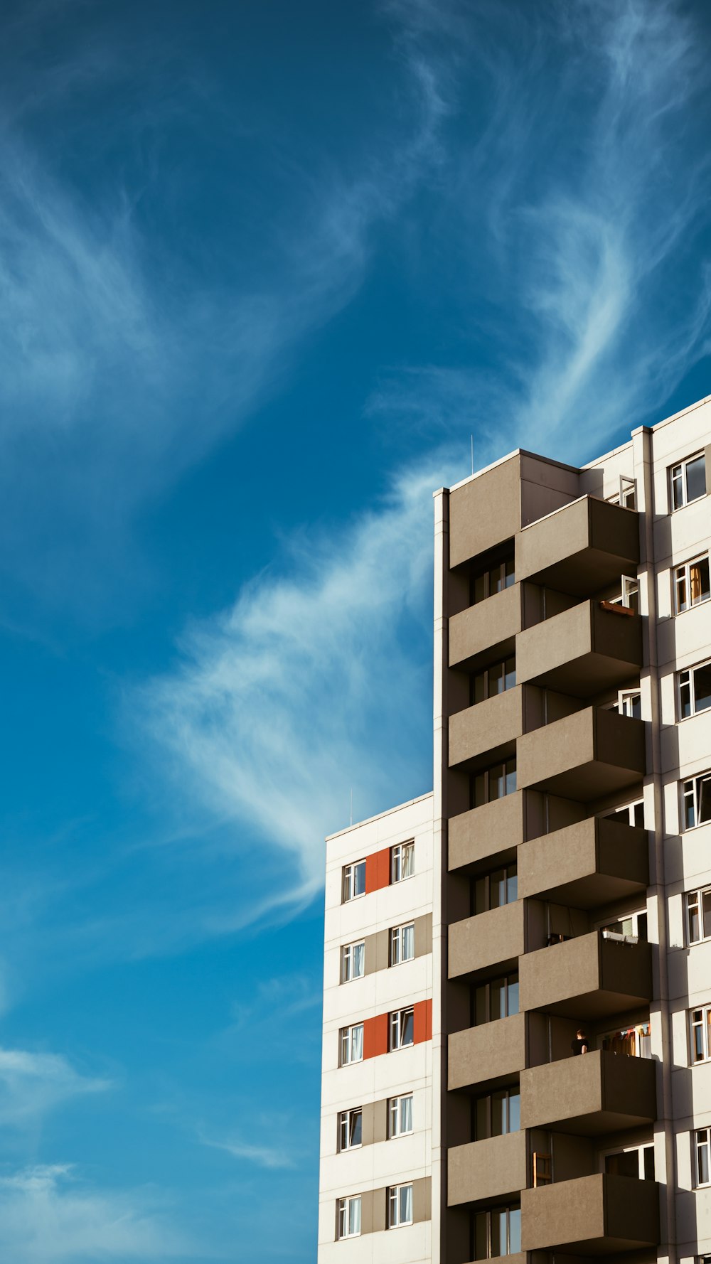 white concrete building under blue sky during daytime