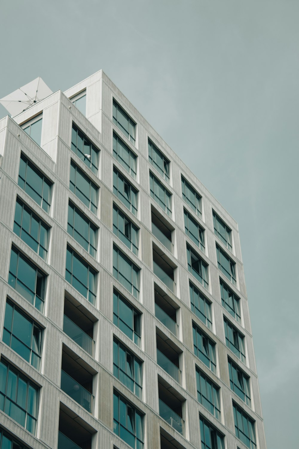 white concrete building under white sky during daytime