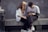 man in white crew neck t-shirt sitting beside woman in white crew neck t-shirt