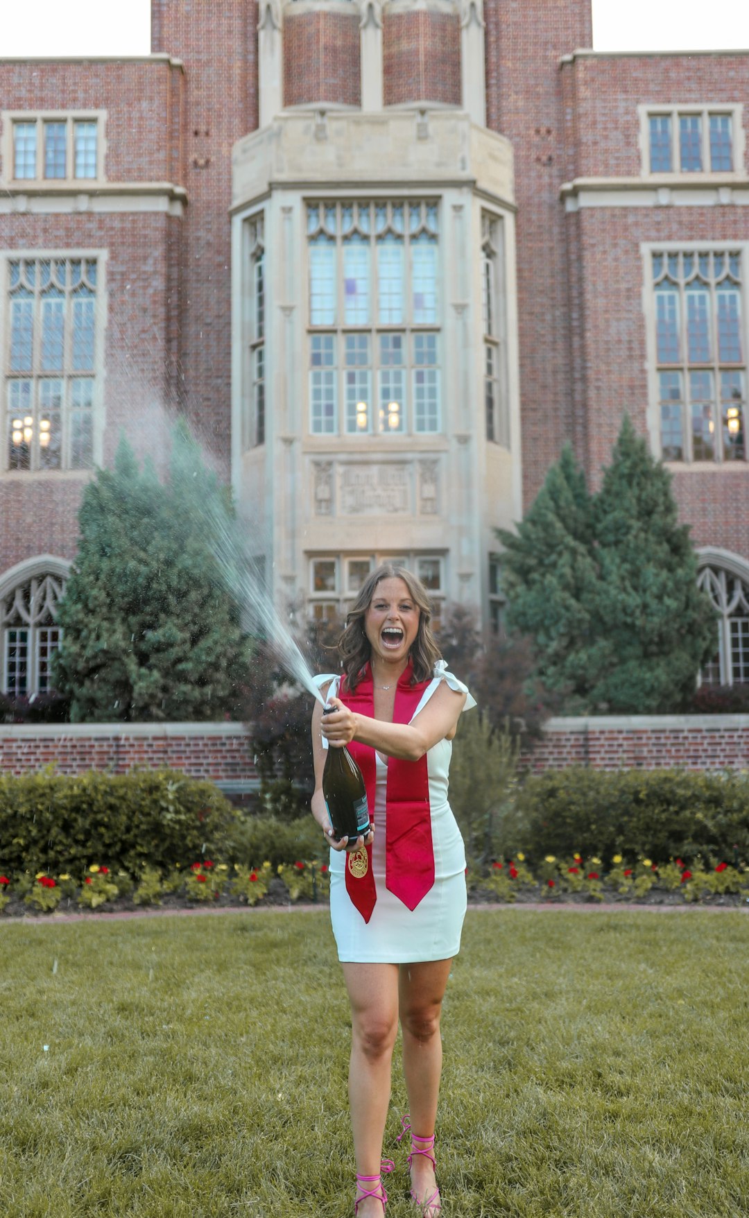 woman in white and red dress holding white powder