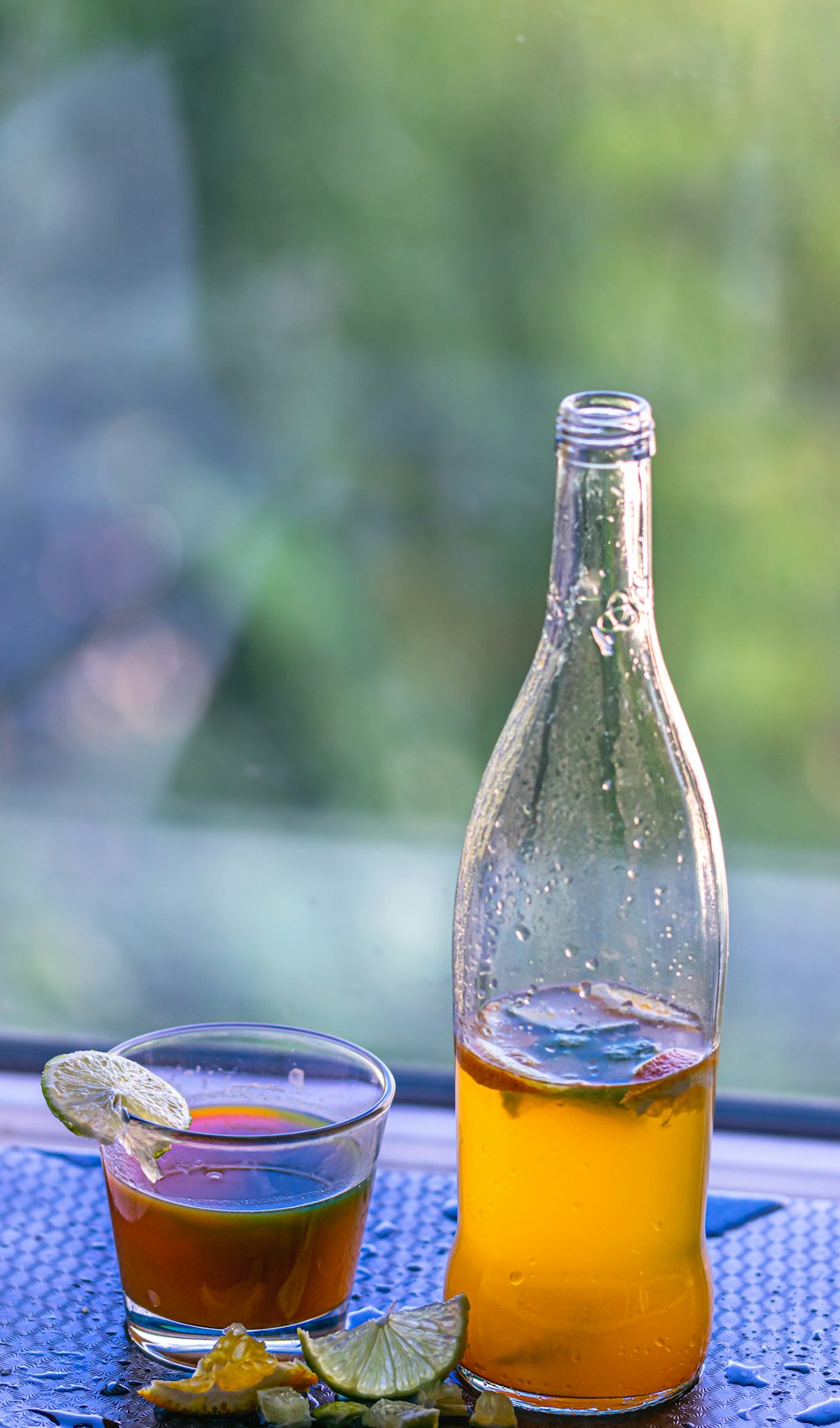 clear glass bottle with yellow liquid