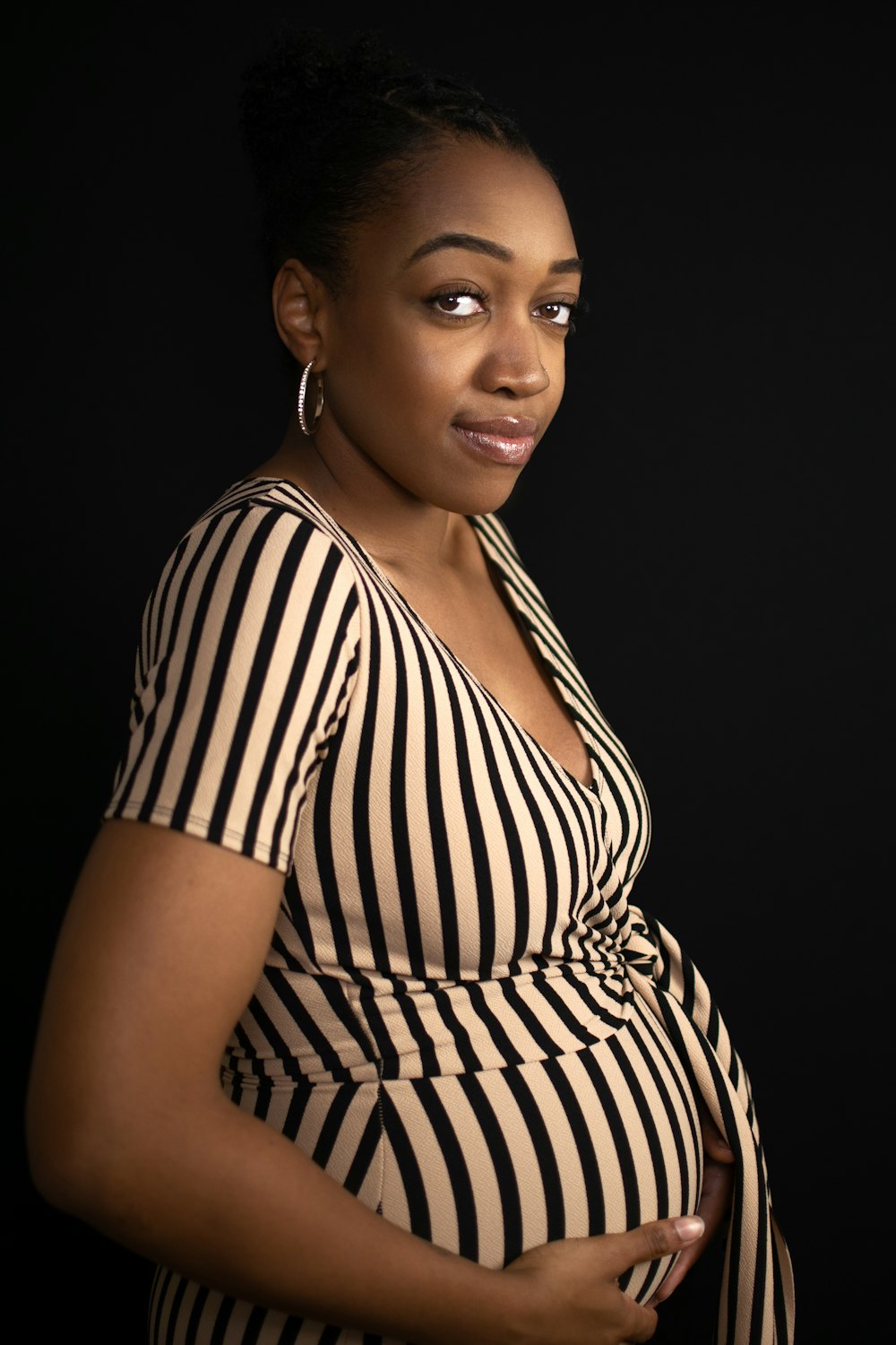 woman in black and white striped dress