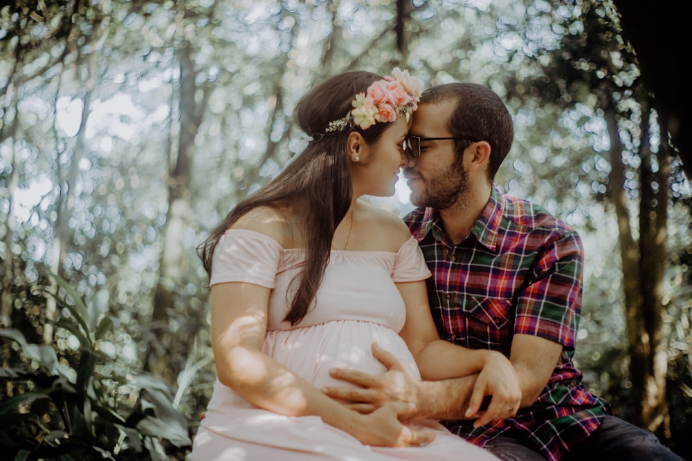 man and woman kissing during daytime