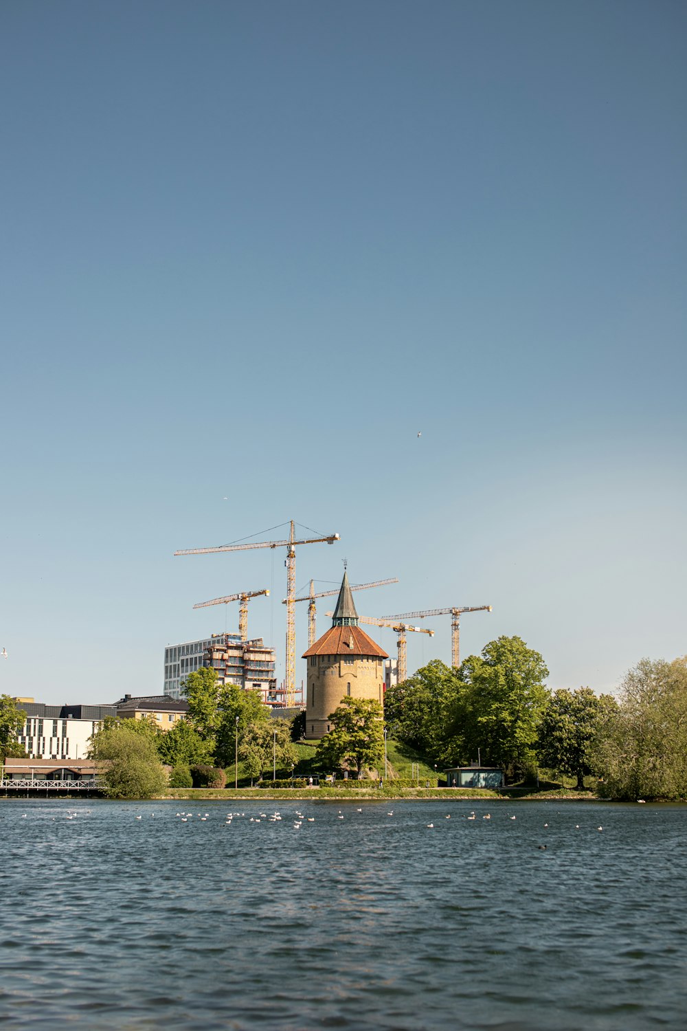 brown concrete building near body of water during daytime