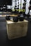 black and gray dumbbells on brown wooden crate
