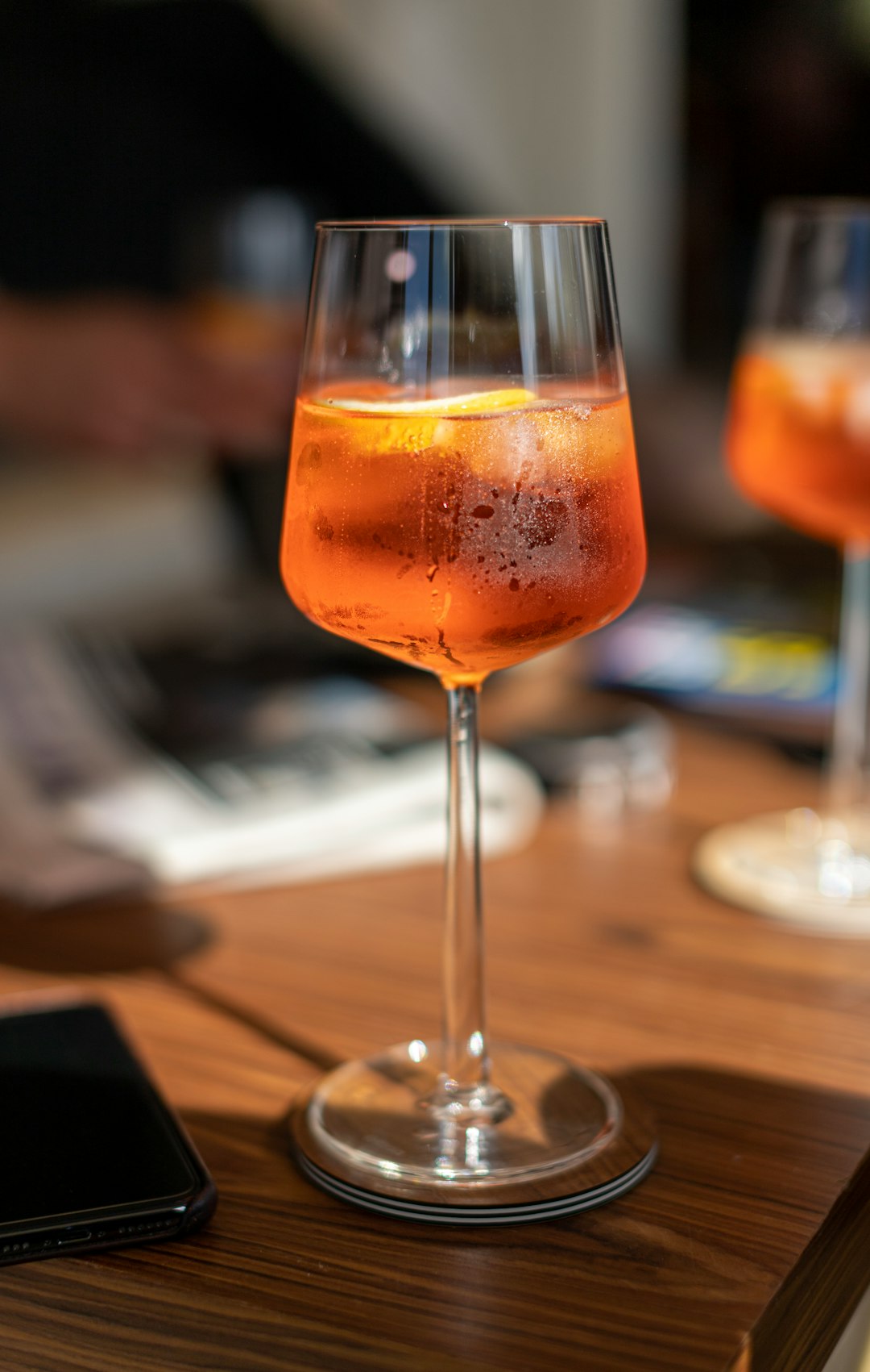 clear wine glass with orange liquid