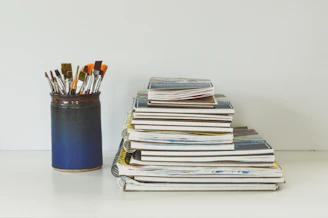 blue and white books on white table