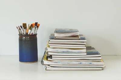 blue and white books on white table