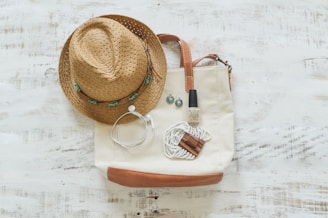 brown fedora hat on white table