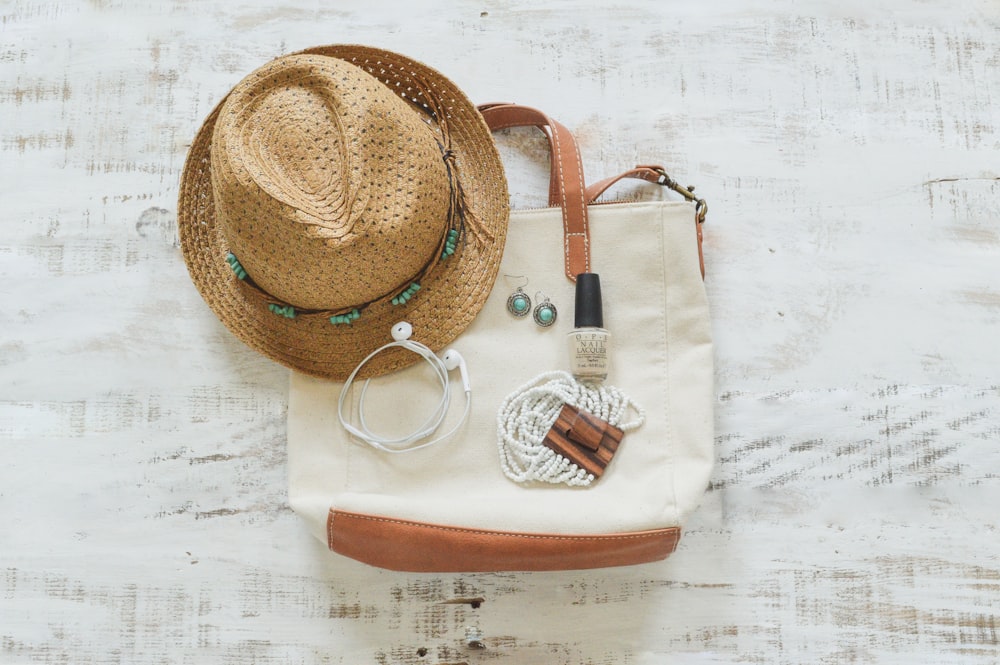 brown fedora hat on white table