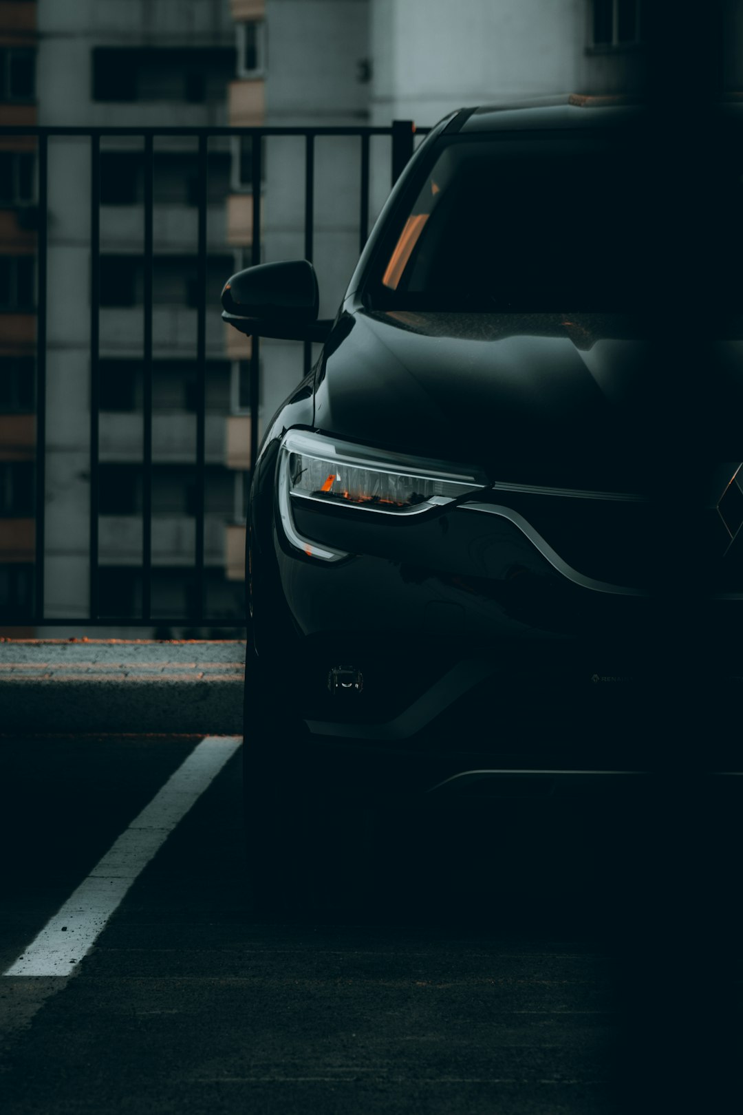 black car parked on sidewalk