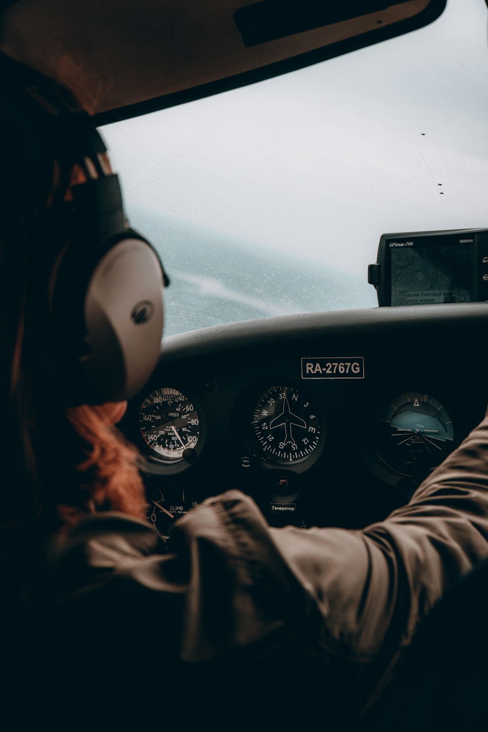 person in gray long sleeve shirt driving car