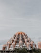 orange and white dome building under white sky during daytime