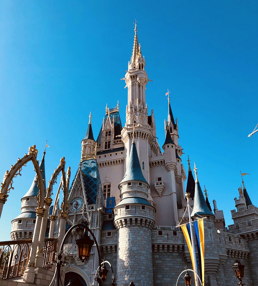 disney castle under blue sky during daytime