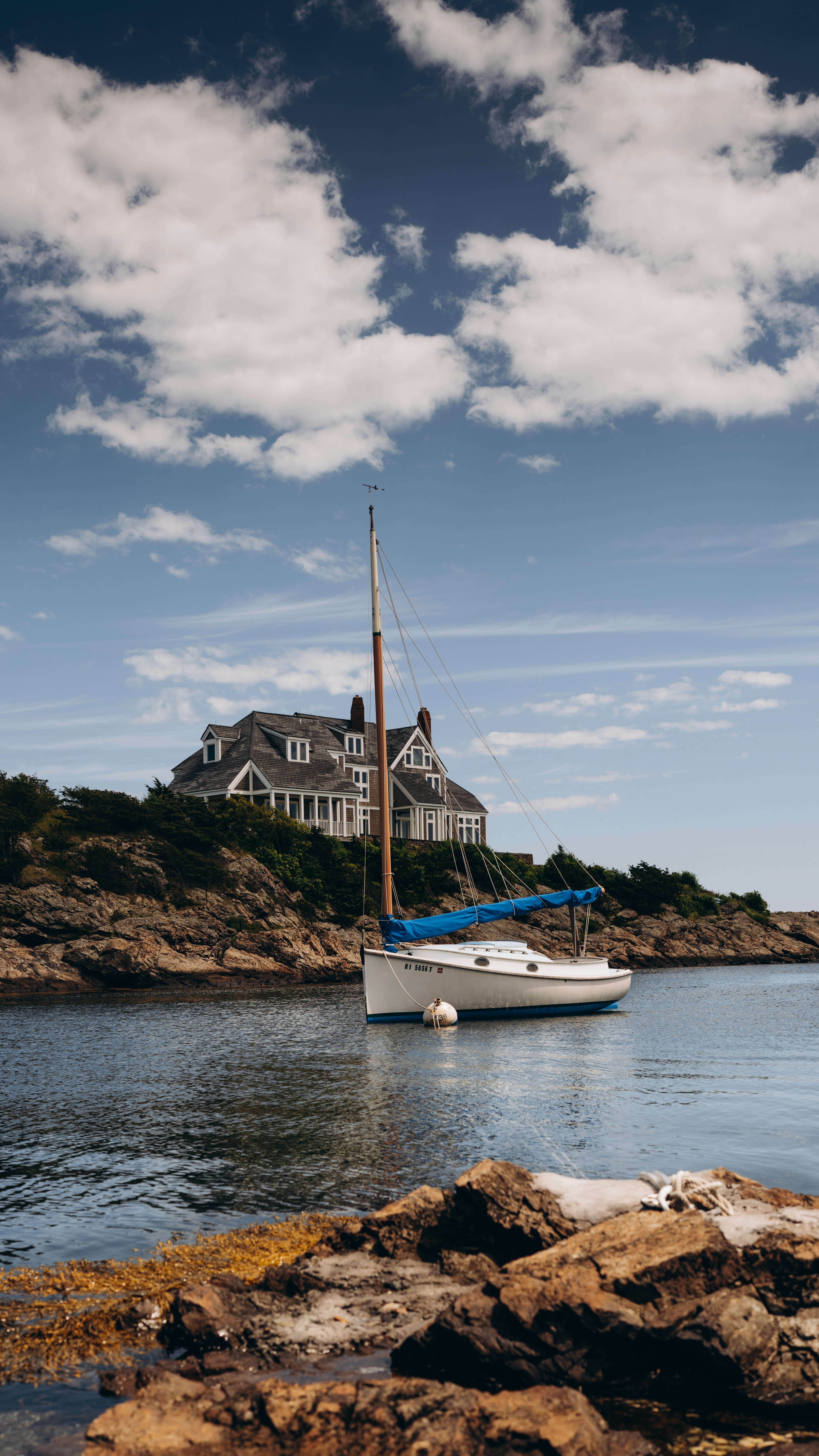 white boat on body of water during daytime