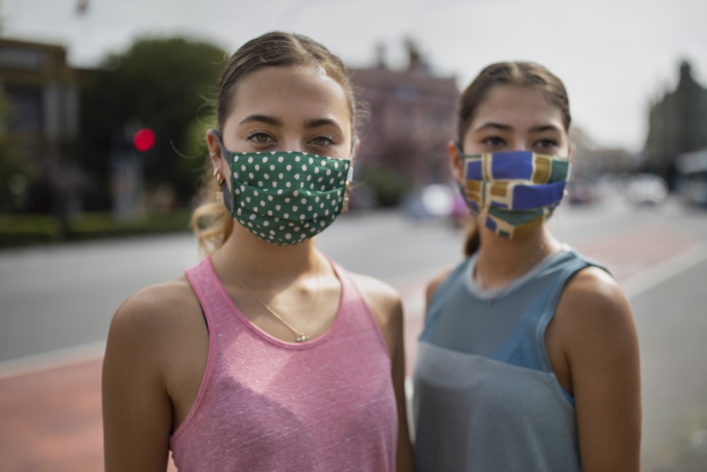 girl in pink tank top with face paint