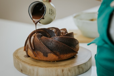 chocolate cake on brown wooden round tray