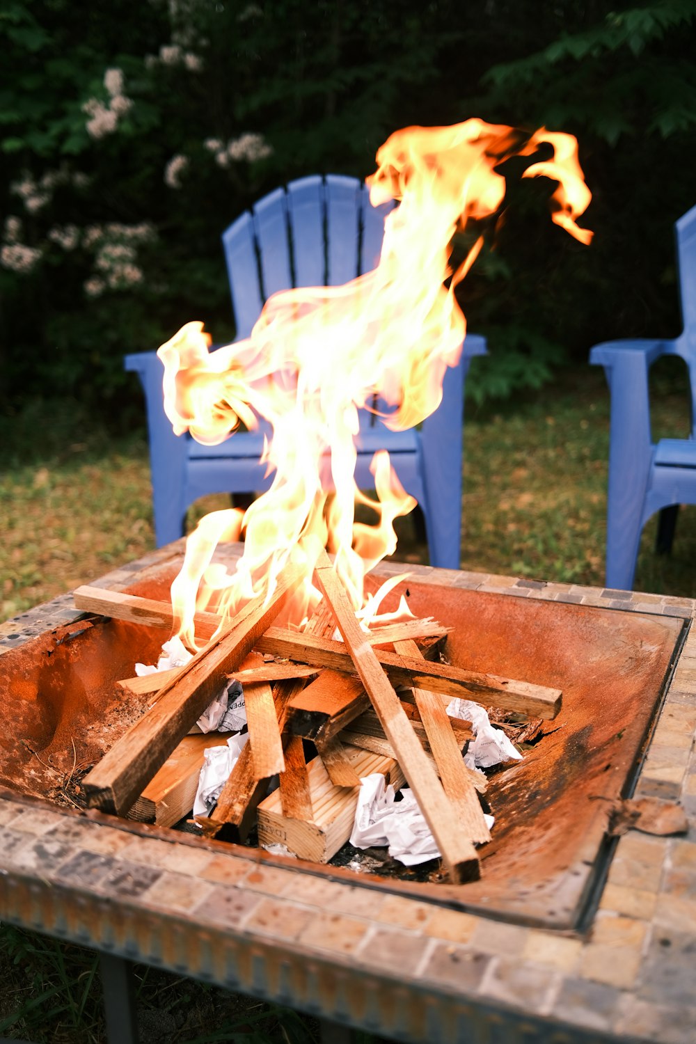 brown firewood on brown fire pit