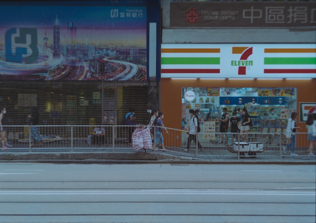 people walking on sidewalk during daytime