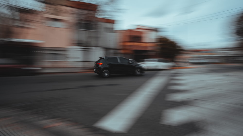 black suv on road during daytime