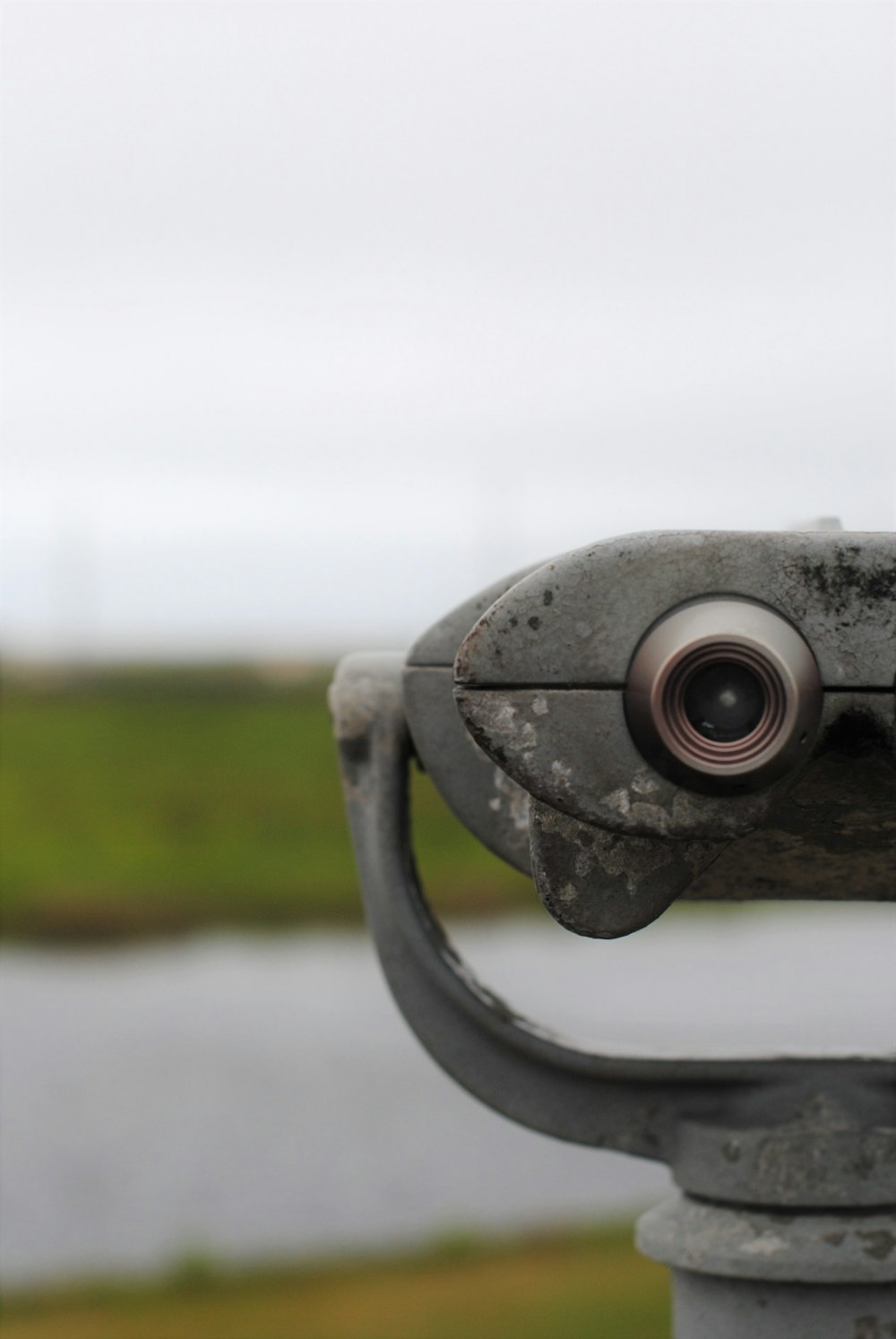 black and silver binoculars on green grass field during daytime