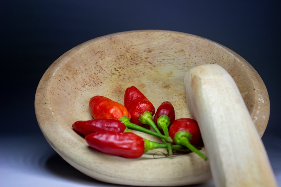  red chili on white ceramic plate pestle