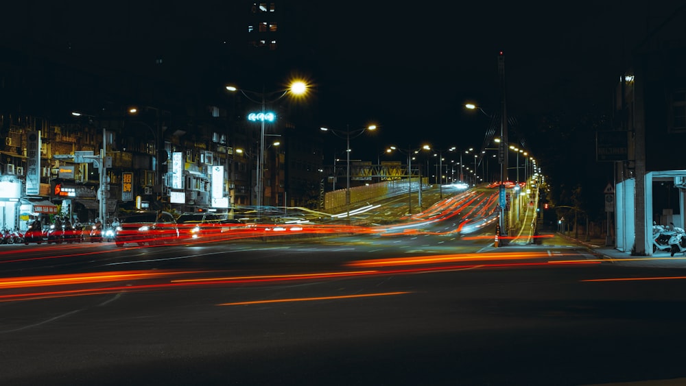 time lapse photography of cars on road during night time