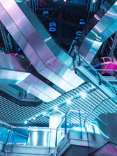 Futuristic AI data center with glassmorphism panels and silver industrial design accents.