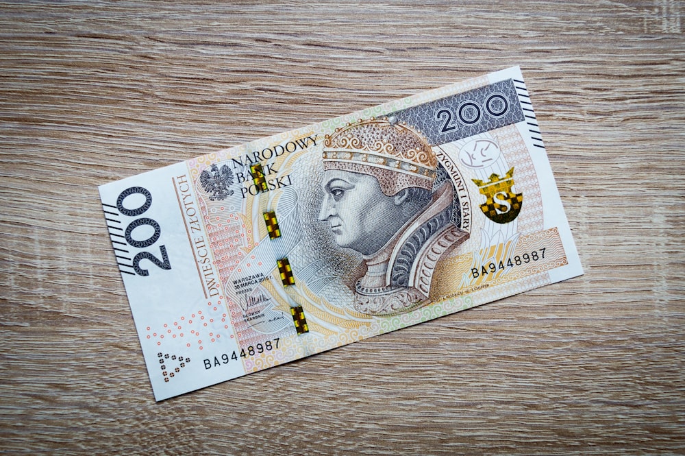 50 banknote on brown wooden table