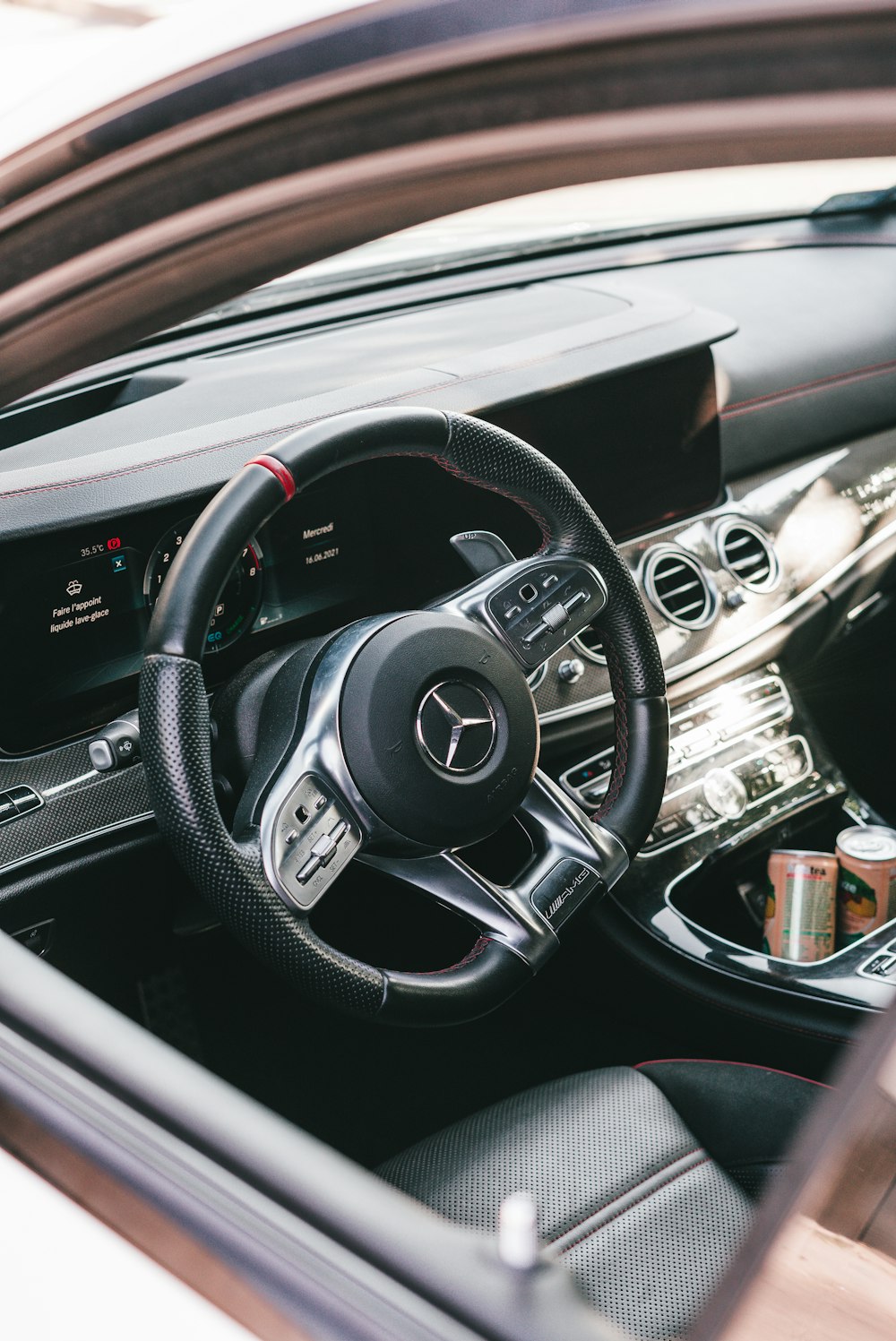 black and silver mercedes benz steering wheel