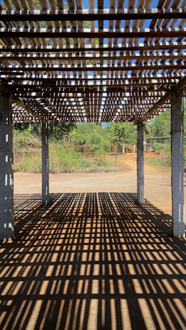 Modern pergola casting soft shadows over a stylish lounge space.