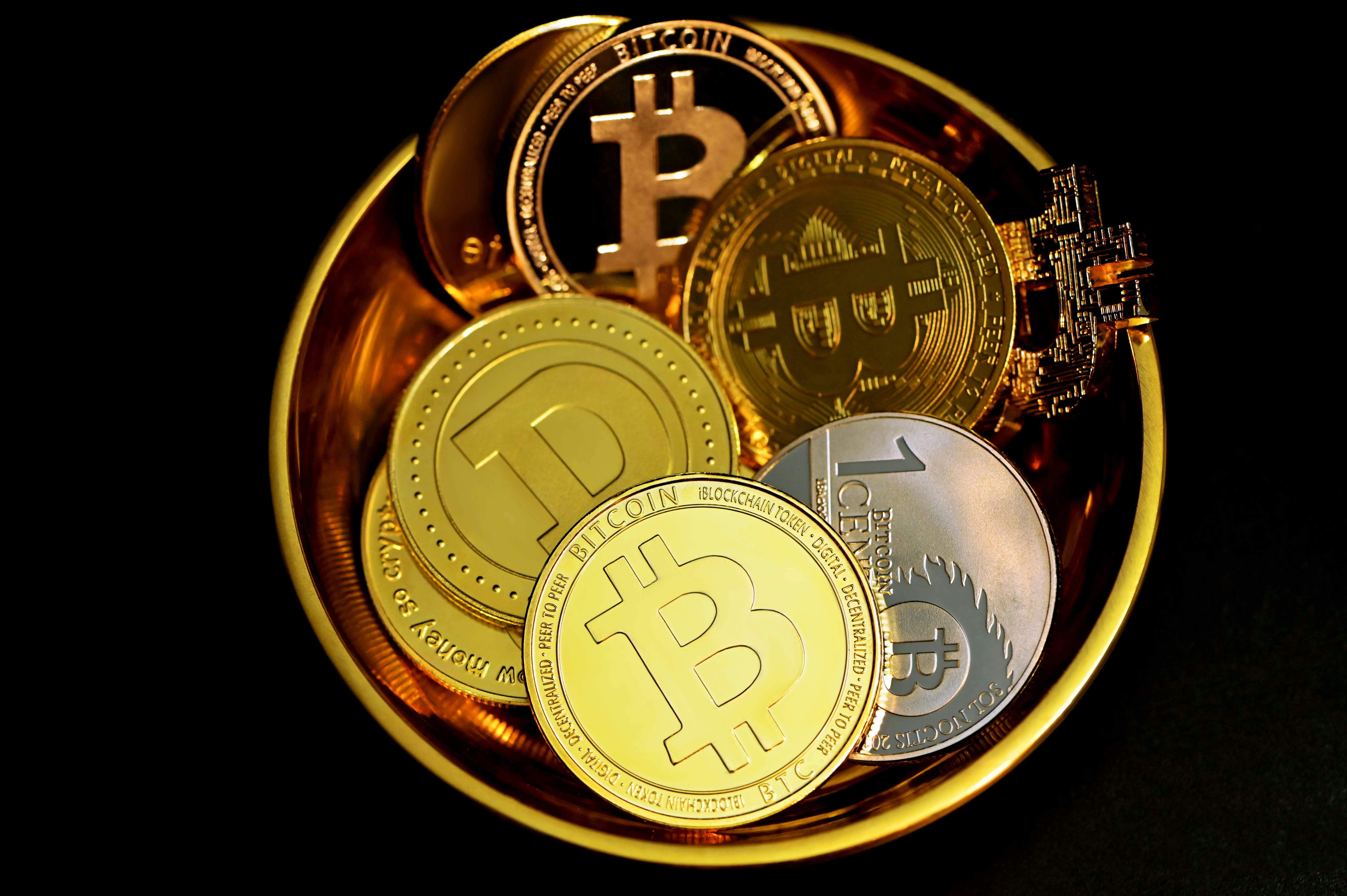 gold round coin on black background