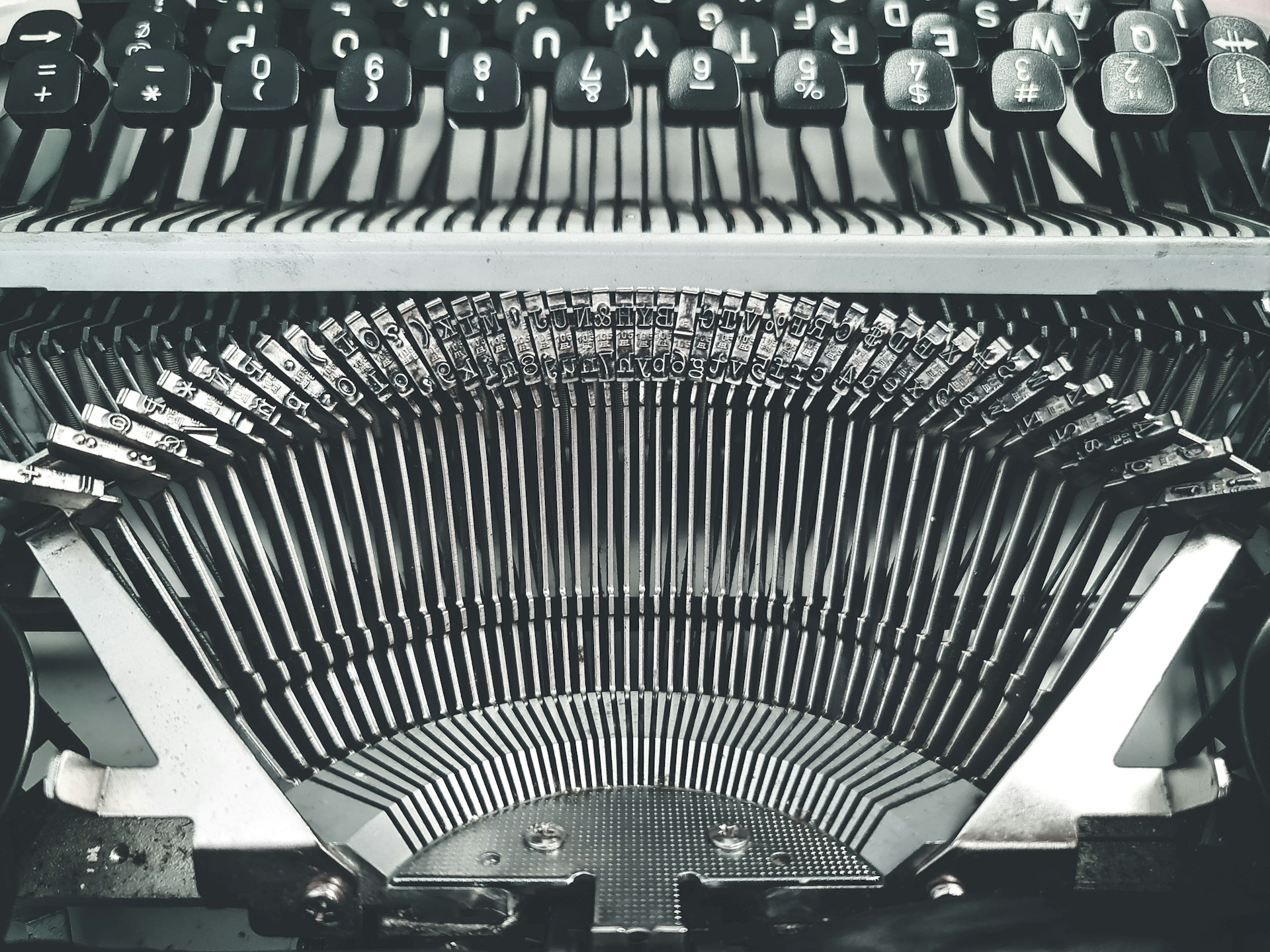 black and white typewriter on white table