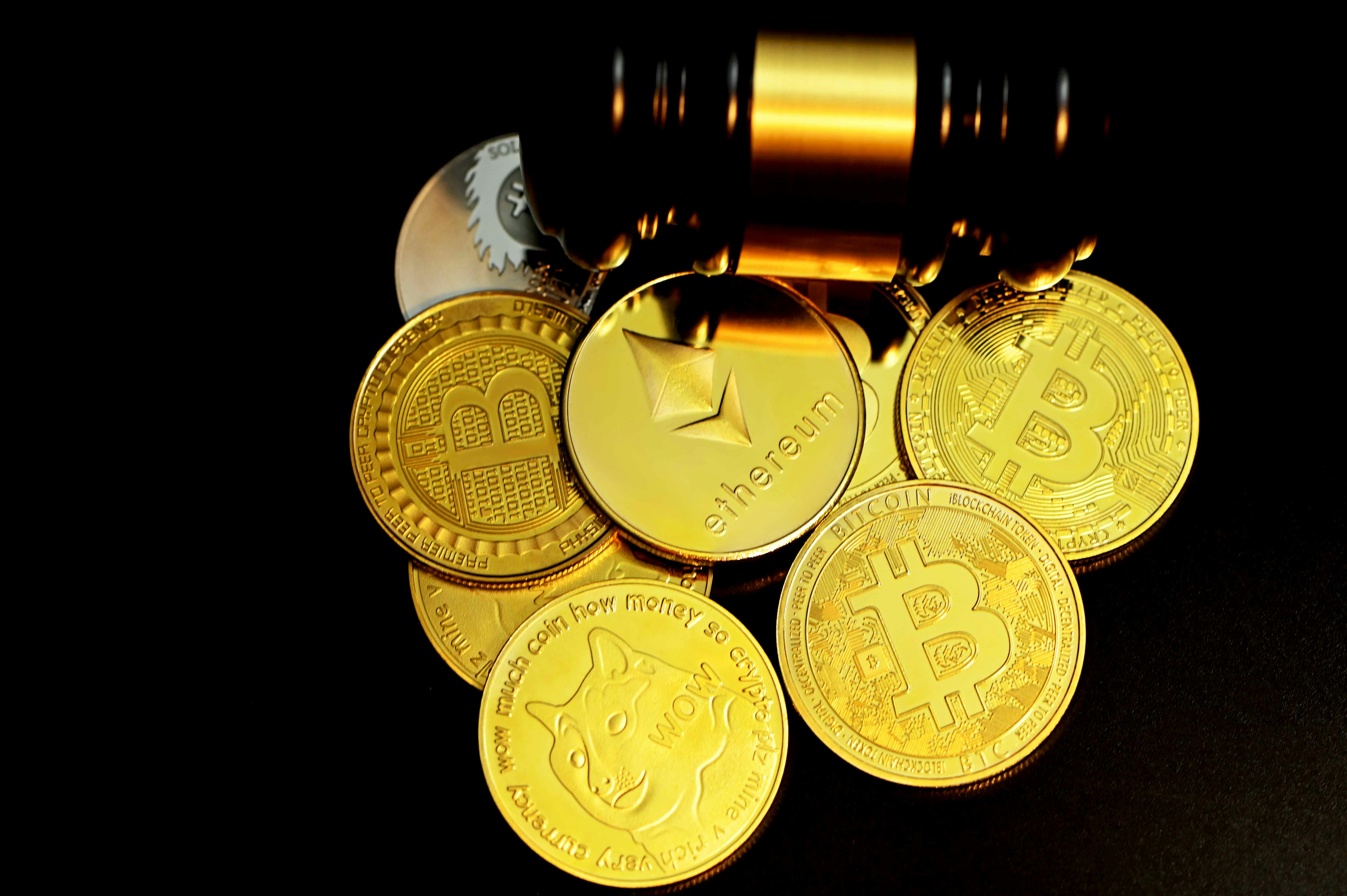 ETH, Bitcoin, Doge coins and a gavel