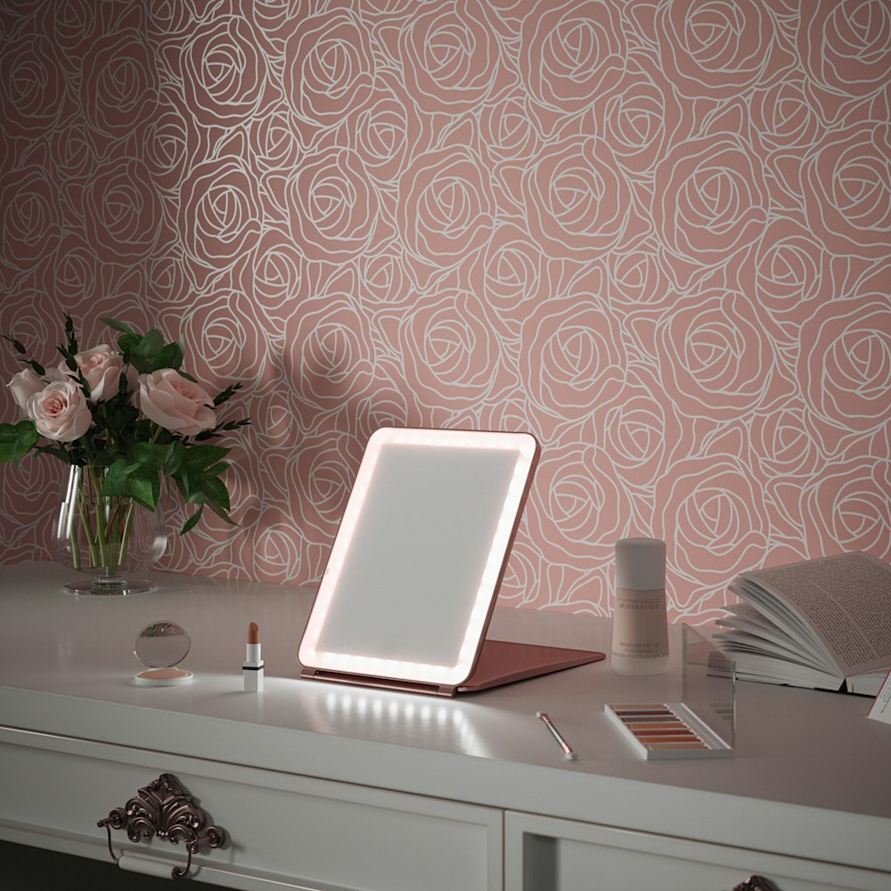 white laptop computer on white wooden table