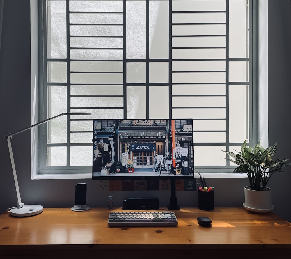 black computer keyboard on brown wooden table