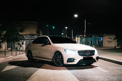 white mercedes benz coupe on road during night time