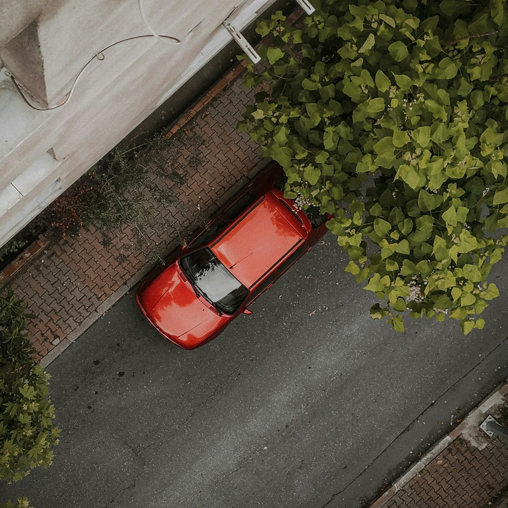 red car parked on the side of the road