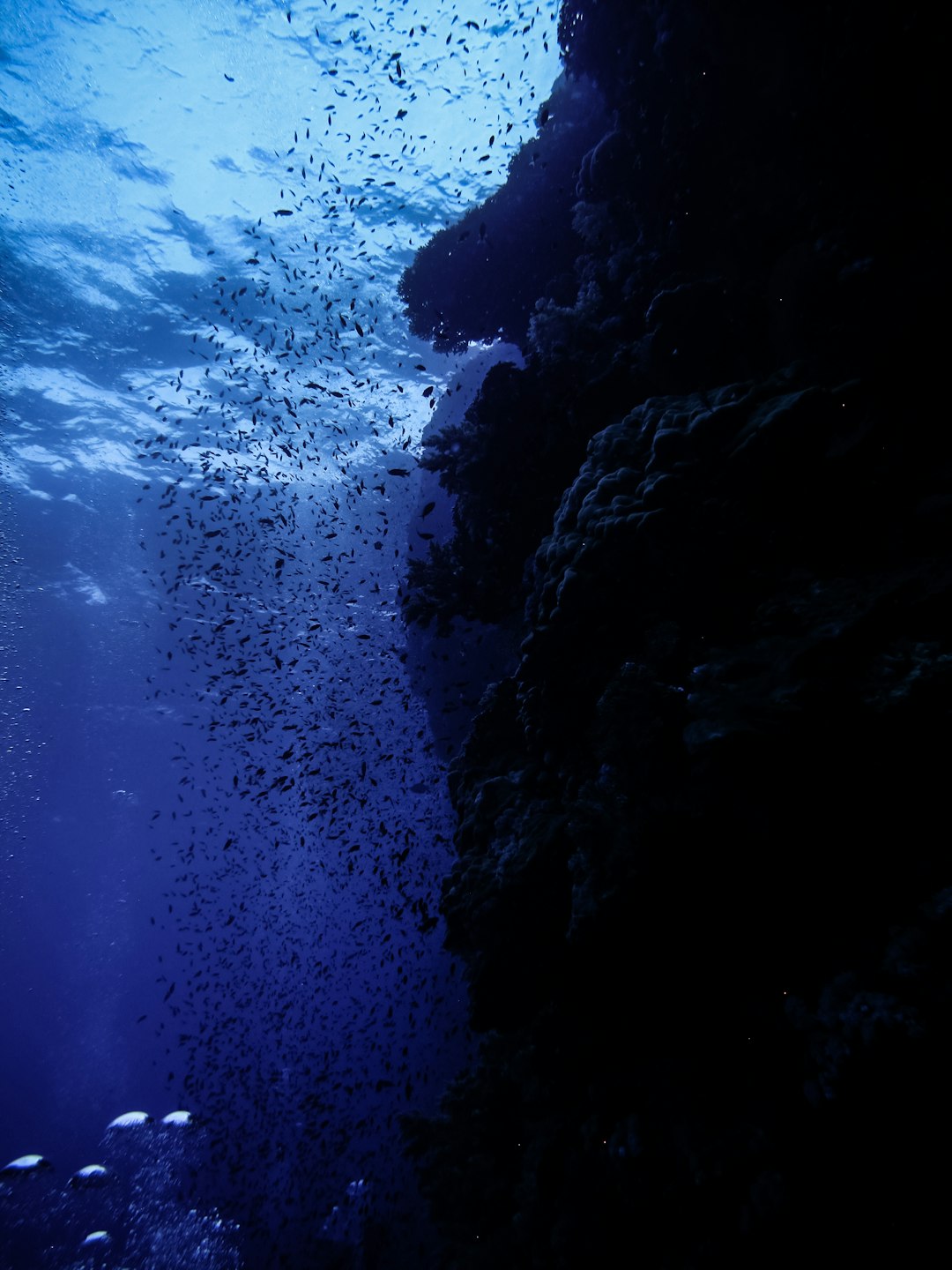 black rock formation under blue sky