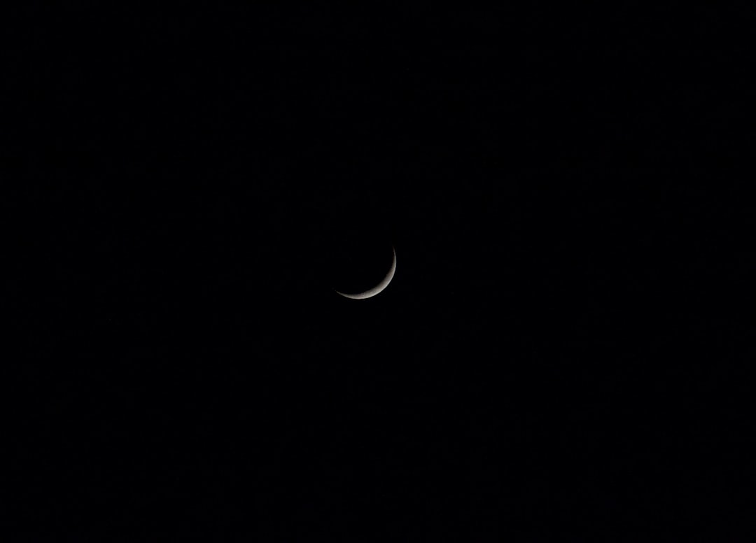 white crescent moon on black background